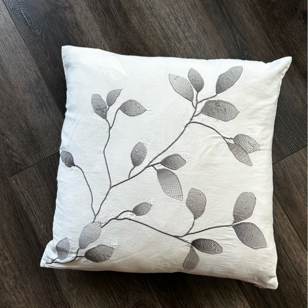 White and grey accent pillow